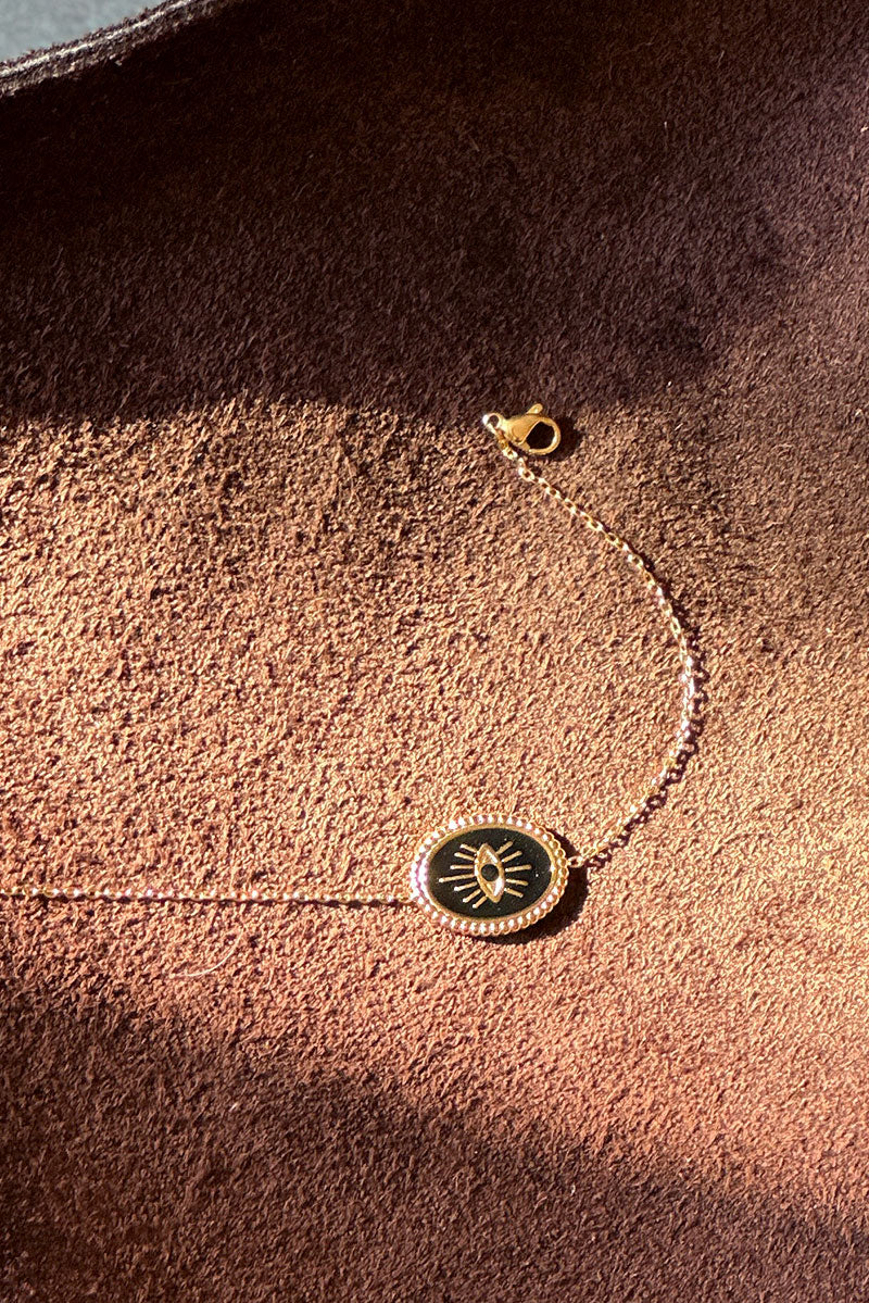 Small chain bracelet with black and gold eye pendant