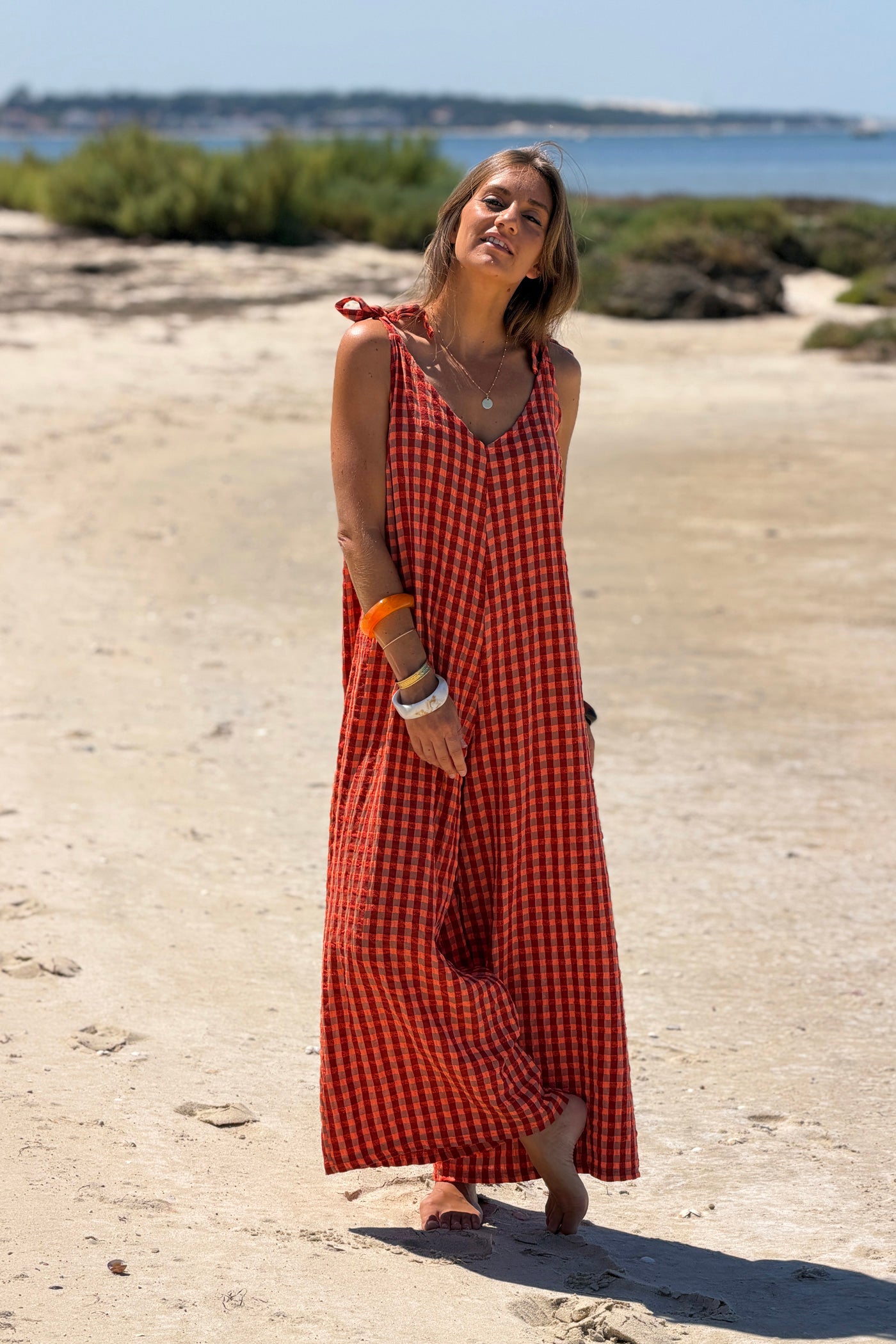 Combi pantalon à carreaux orange terracotta effet texturé bretelles nœuds