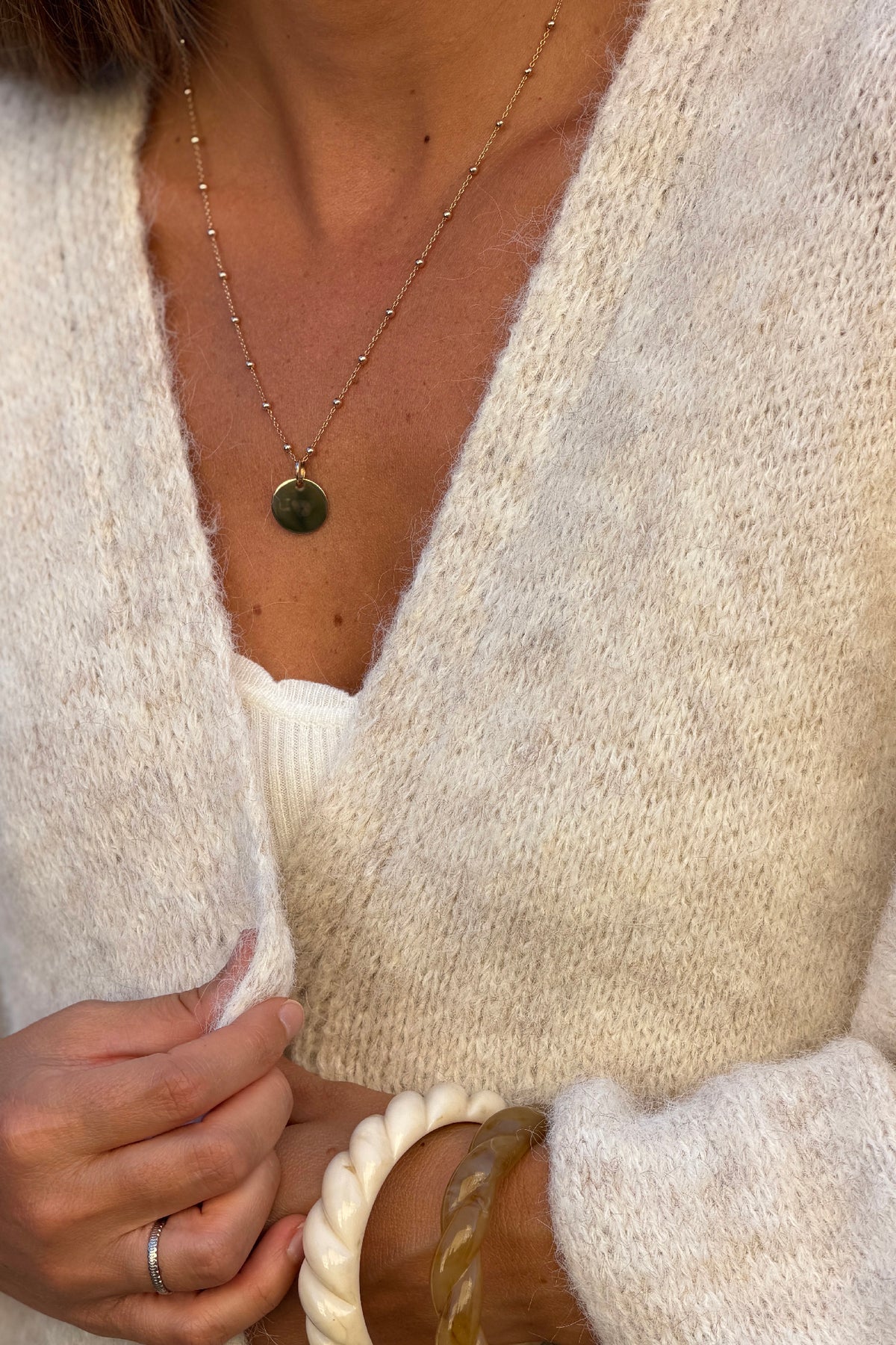 Gilet beige en maille coupe loose manches chauve-souris trois-quarts