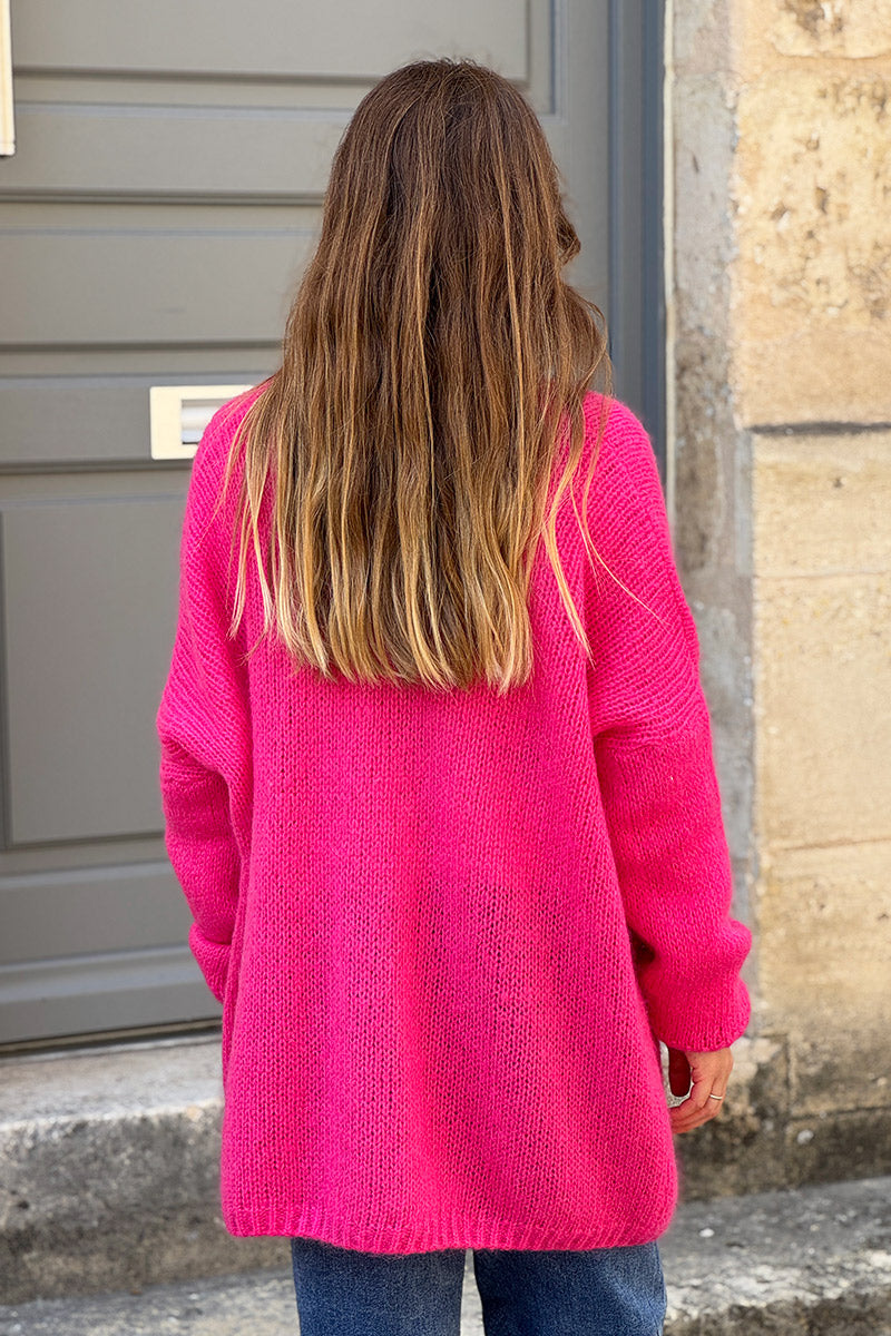 Cárdigan fucsia con cuello cruzado y bolsillos