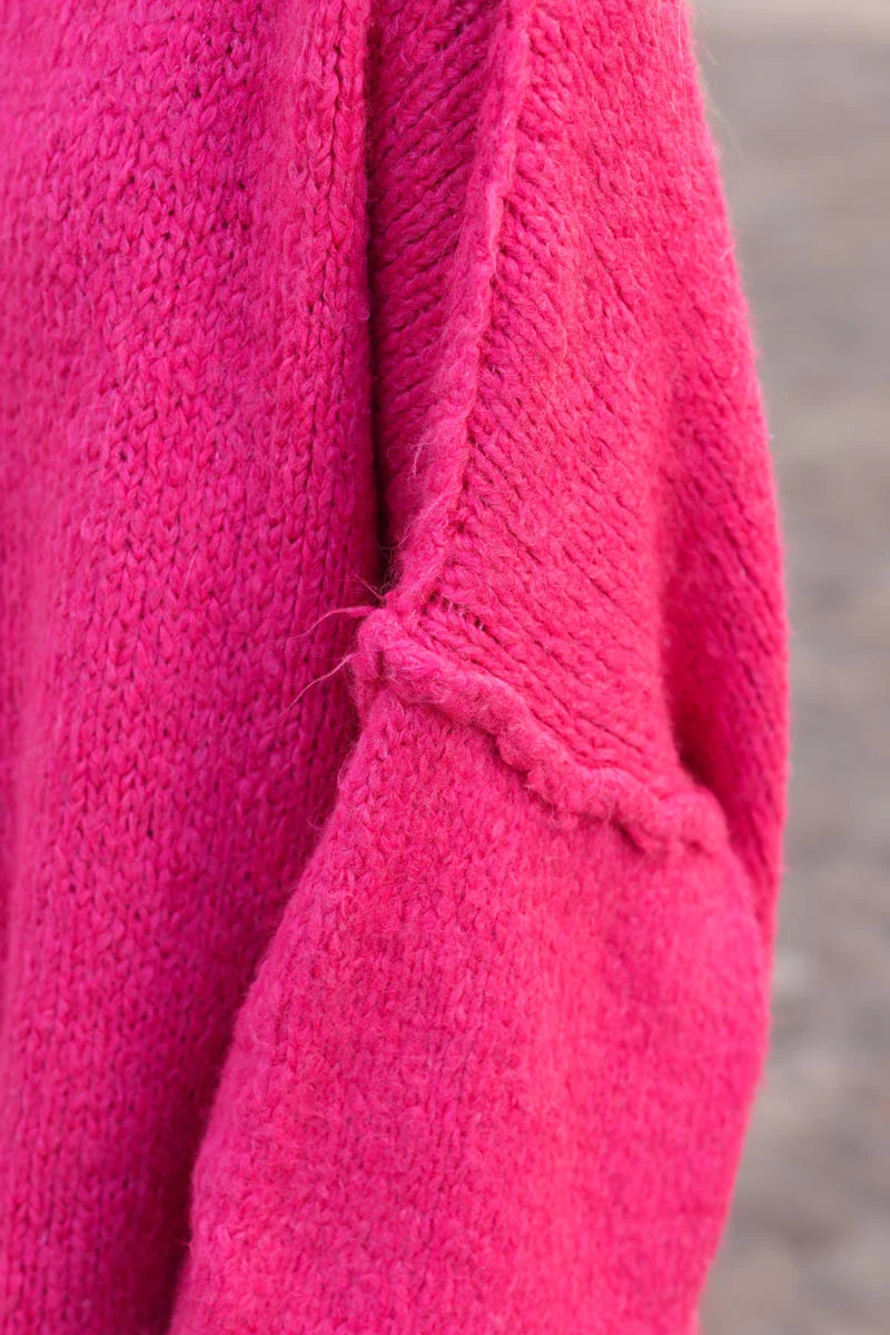 Gros pull large fuchsia en maille chaude couture apparente