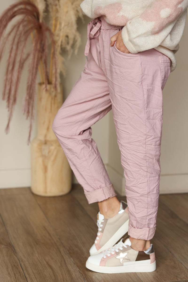 Soft pink comfort and stretch fabric pants with a glitter star