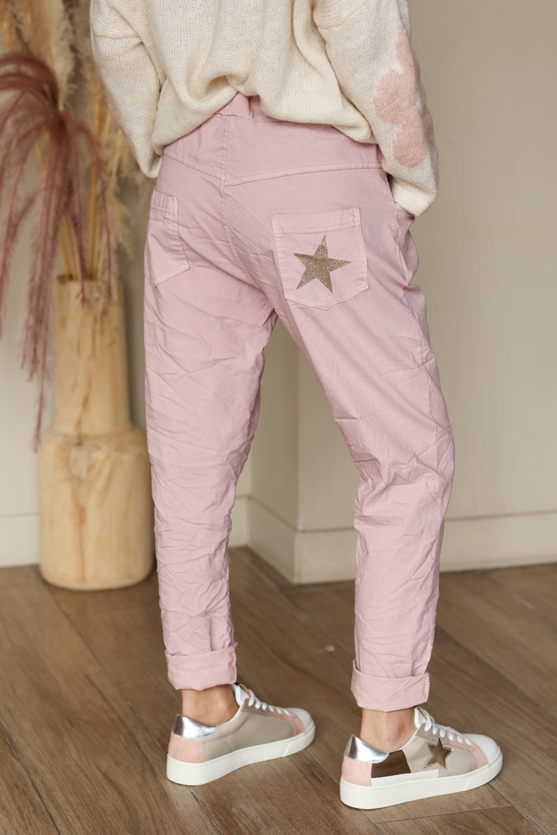 Soft pink comfort and stretch fabric pants with a glitter star