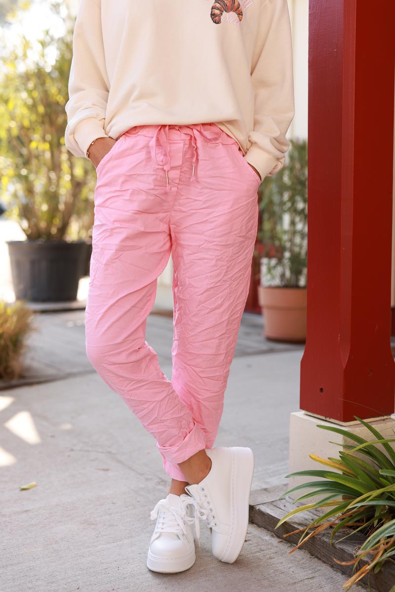 Pink comfort and stretch fabric trousers with a glitter star