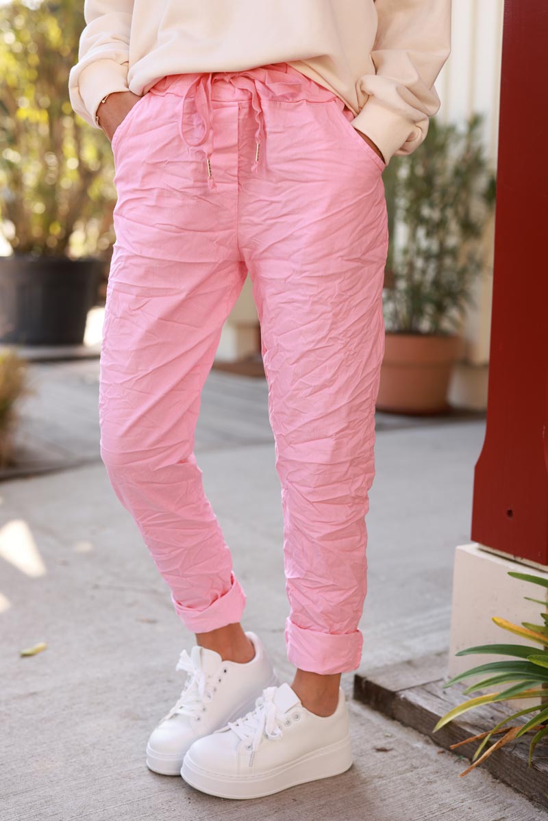 Pink comfort and stretch fabric trousers with a glitter star