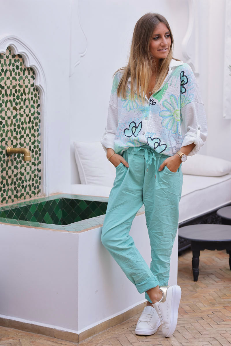 Pantalón confort turquesa de lona elástica con estrellas brillantes y purpurina