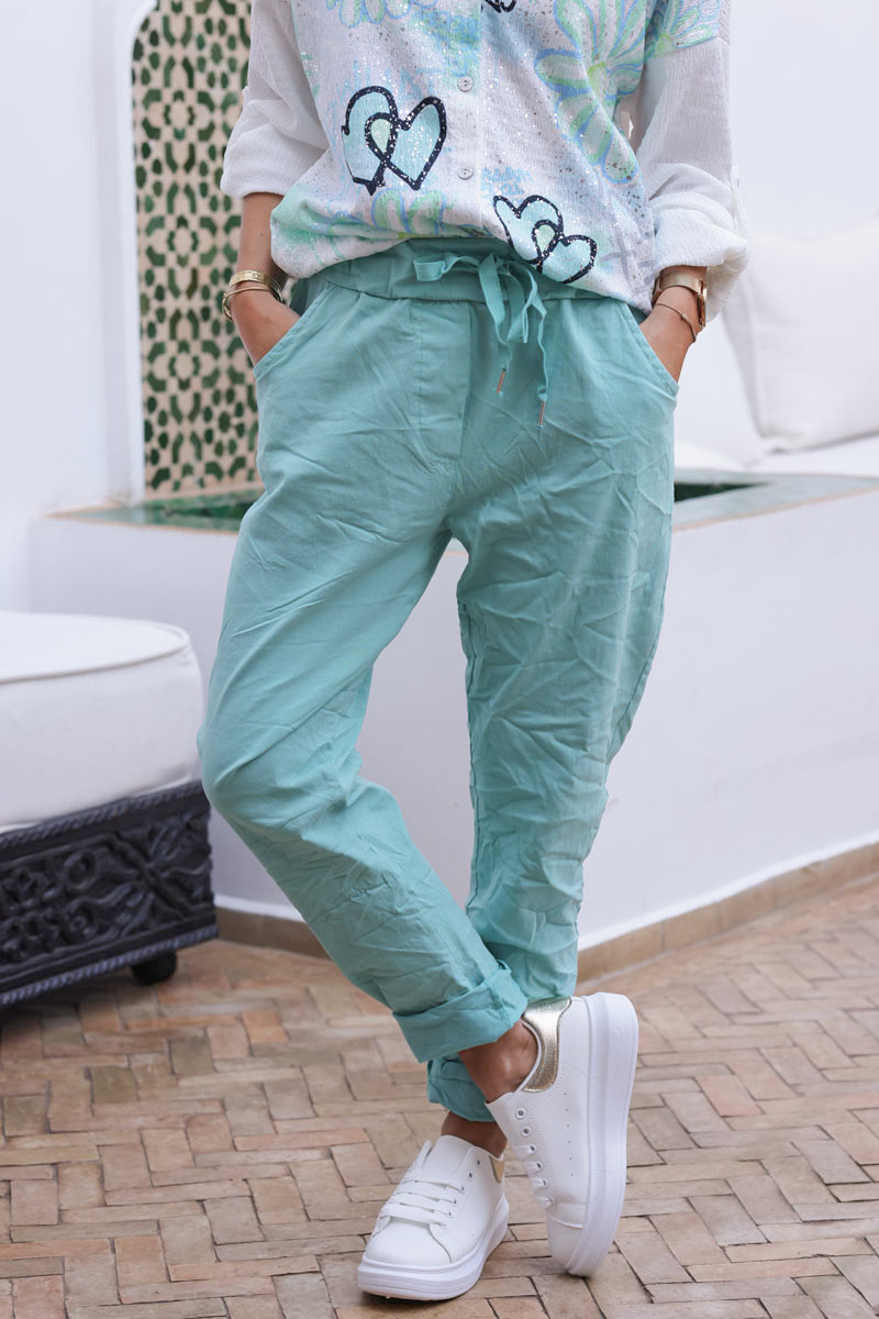 Pantalón confort turquesa de lona elástica con estrellas brillantes y purpurina