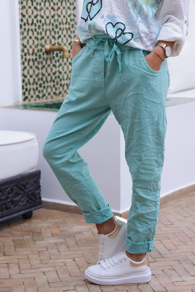 Pantalón confort turquesa de lona elástica con estrellas brillantes y purpurina