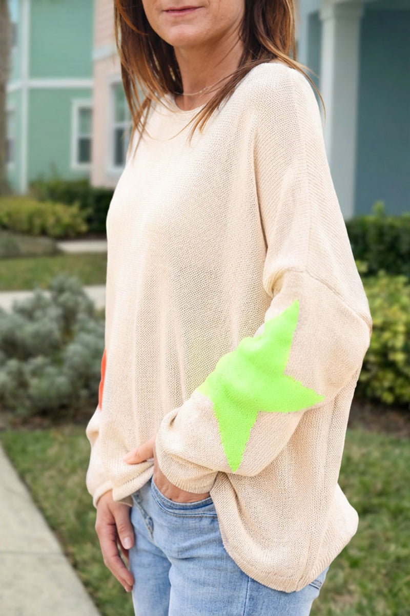 Beige knit sweater with colourful stars