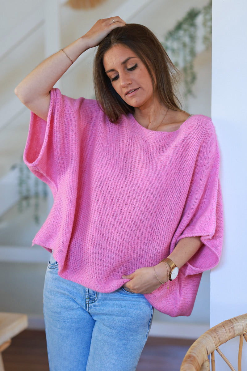 Suéter de punto rosa con mangas anchas de murciélago y cuello redondo