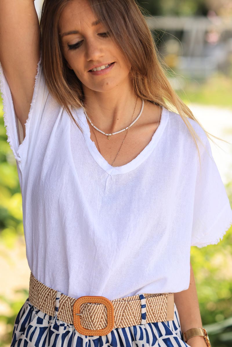 Top blanc en coton effet piqué détails et col v franges