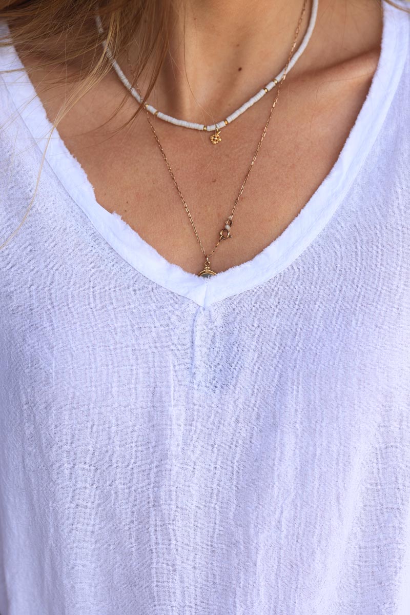 Top blanc en coton effet piqué détails et col v franges
