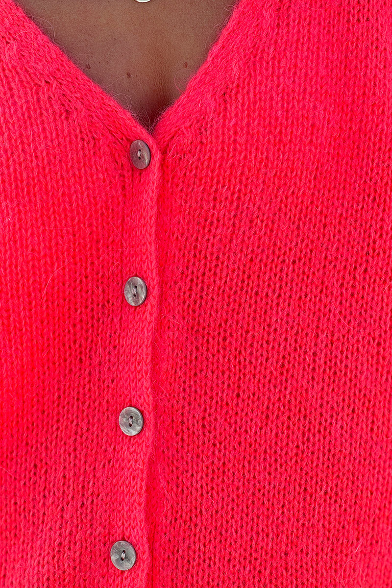 Gilet uni corail fluo en maille fine avec petits boutons nacrés