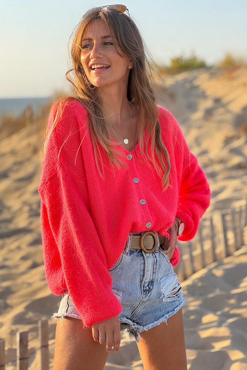 Gilet uni corail fluo en maille fine avec petits boutons nacrés