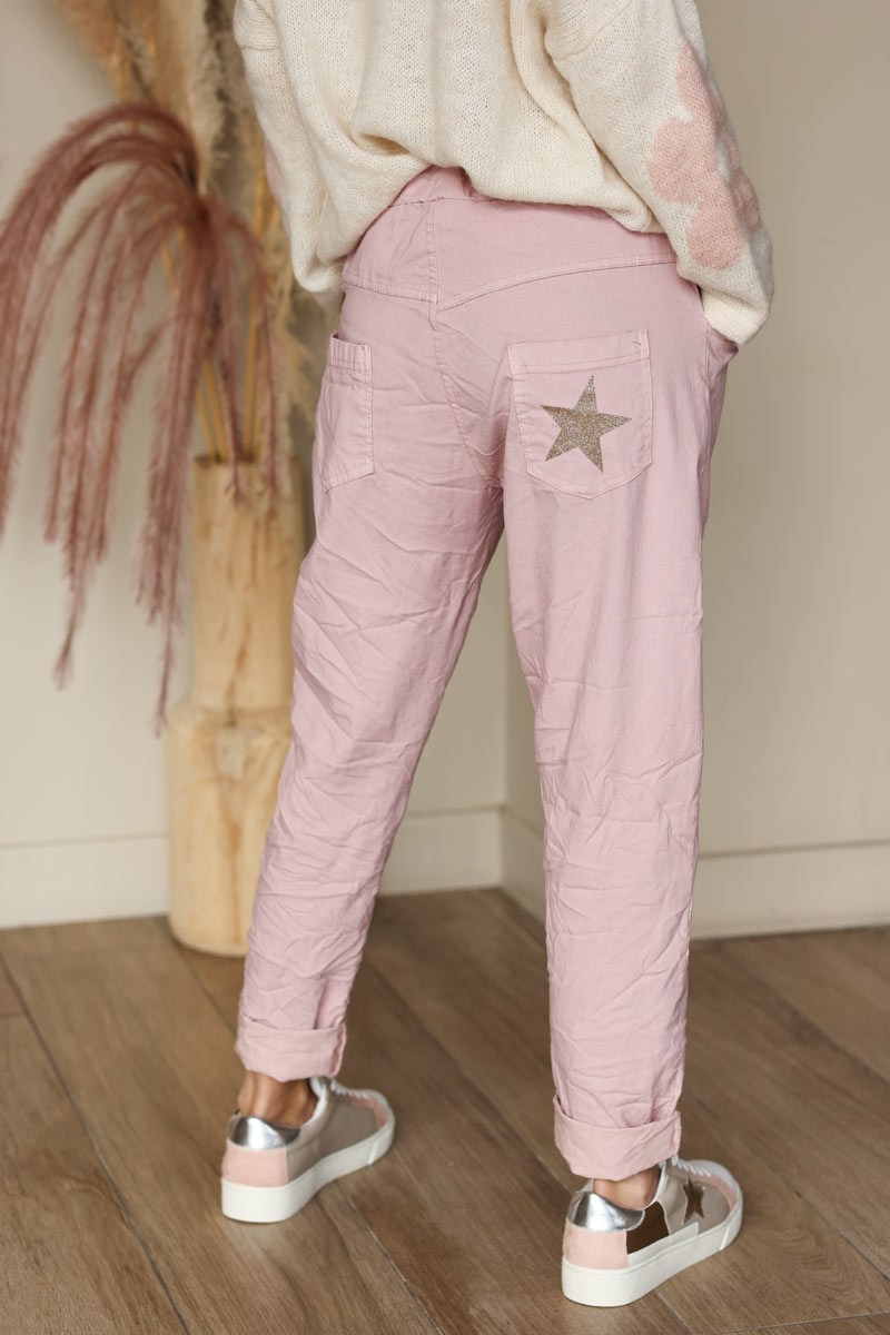Soft pink comfort and stretch fabric pants with a glitter star
