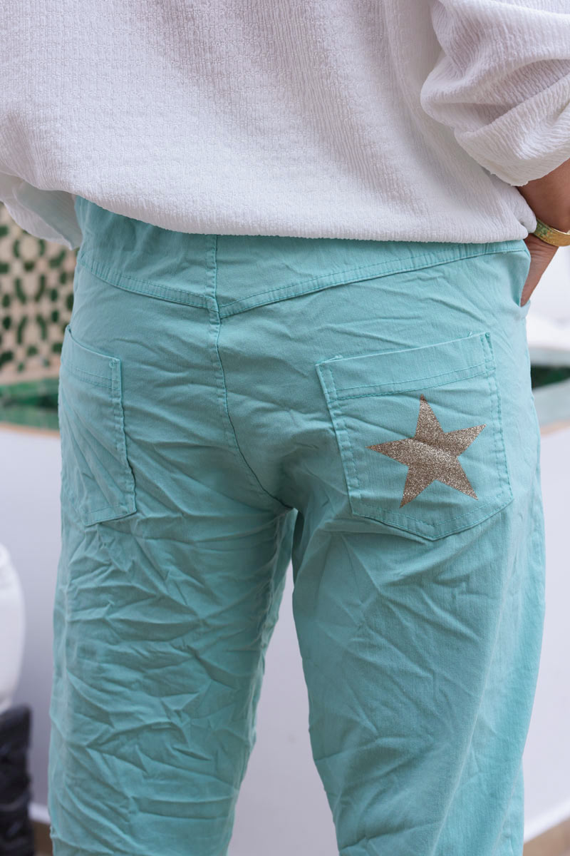 Pantalón confort turquesa de lona elástica con estrellas brillantes y purpurina