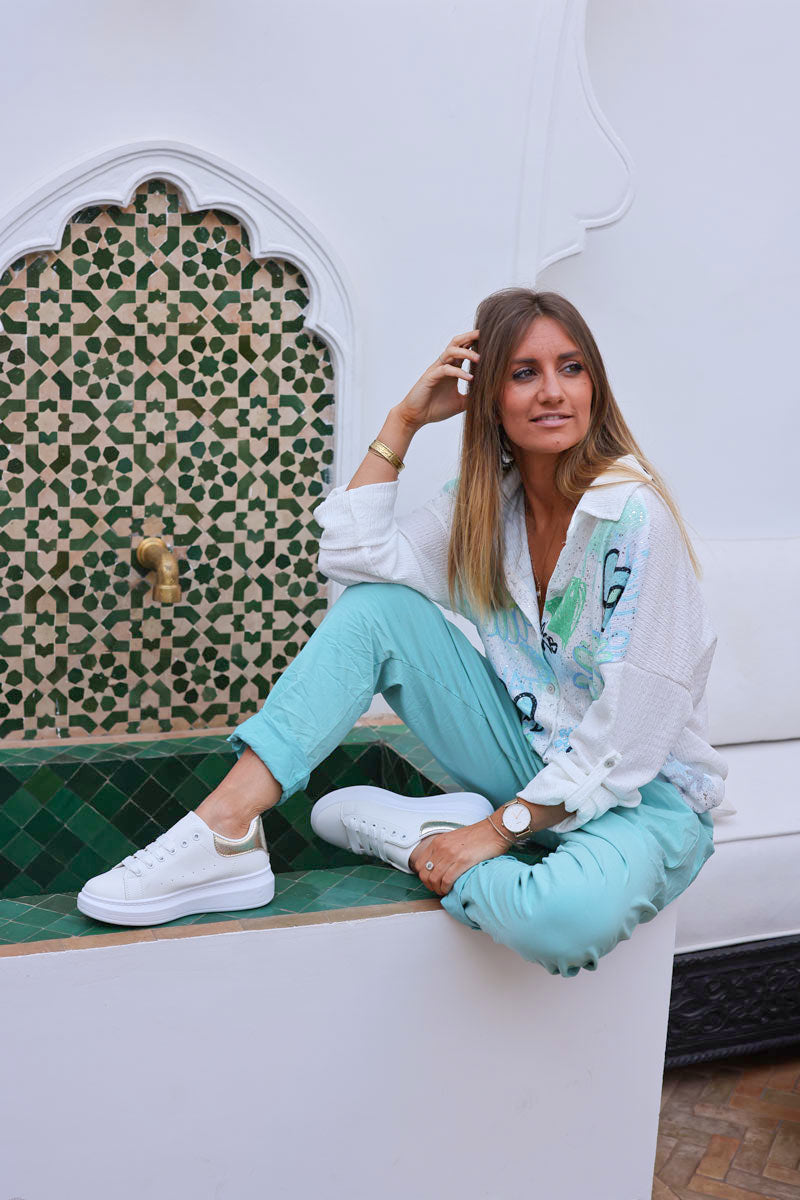 Pantalón confort turquesa de lona elástica con estrellas brillantes y purpurina
