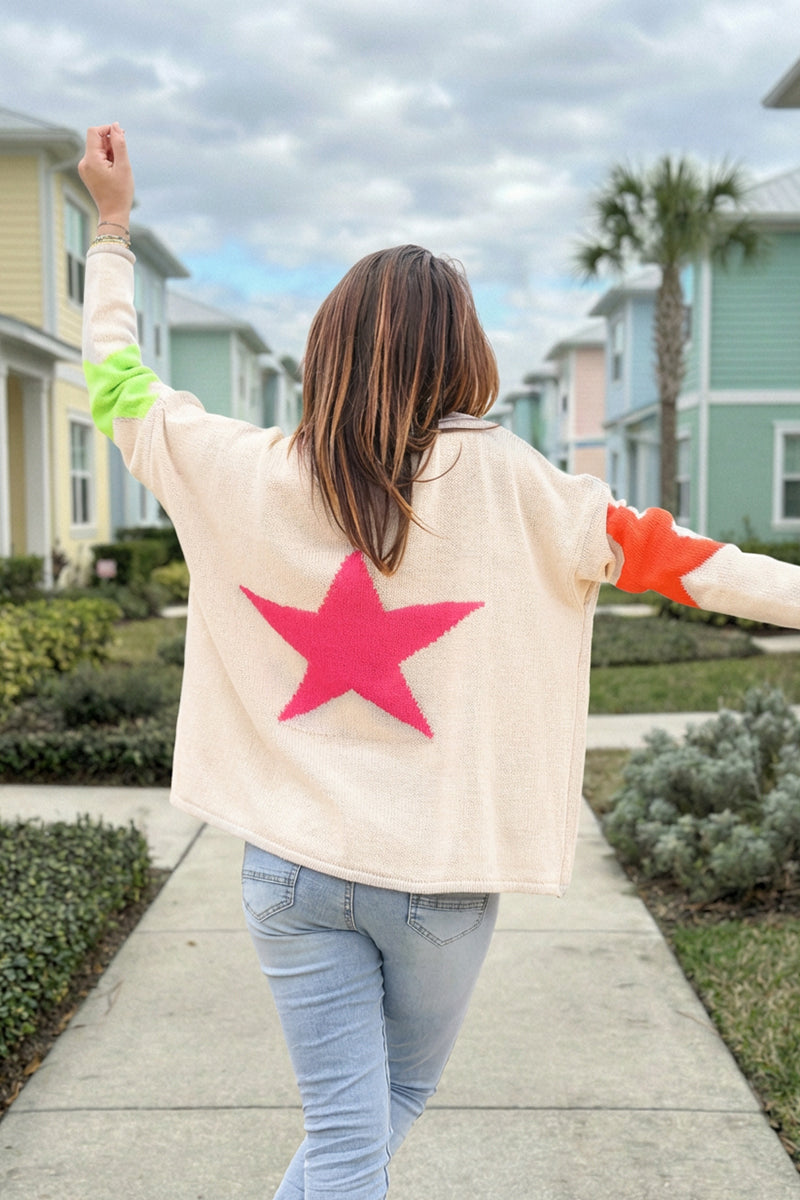 Beige knit sweater with colourful stars