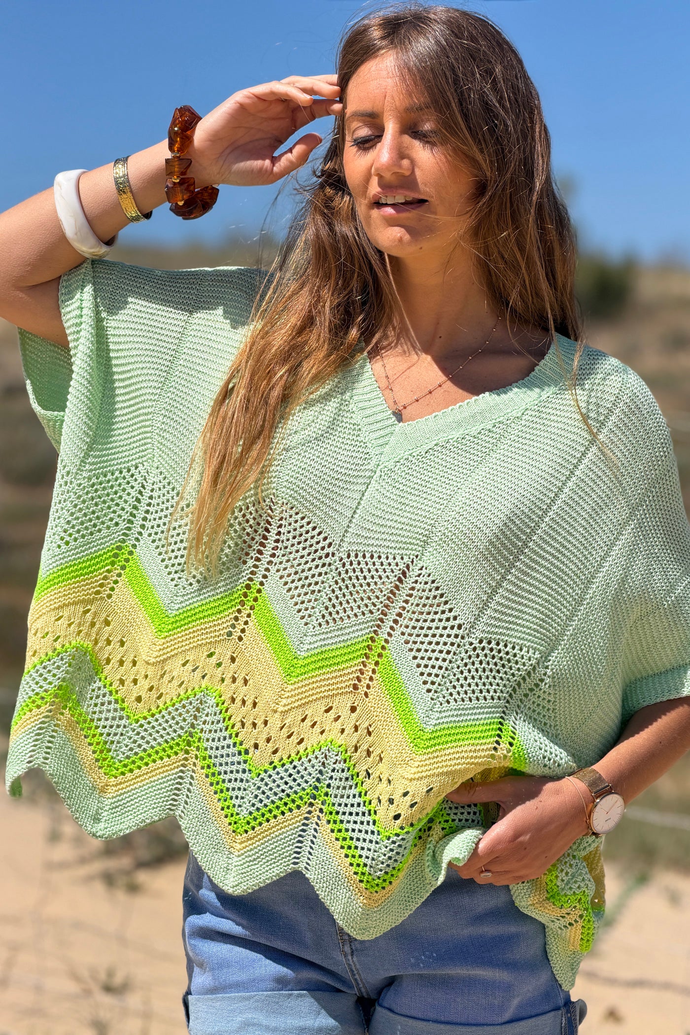 Pull en maille ajourée vert pastel motifs chevrons jaunes