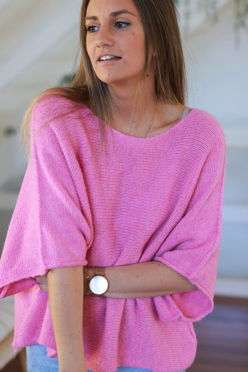 Suéter de punto rosa con mangas anchas de murciélago y cuello redondo