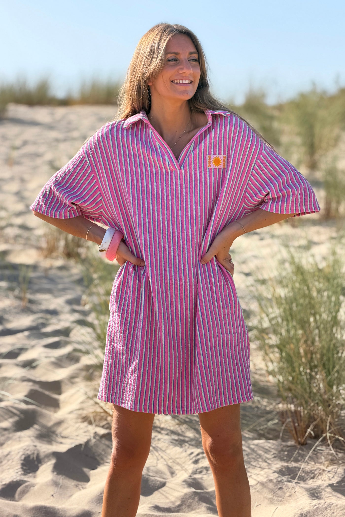 Robe polo rose en éponge à rayures pastel détails Soleil