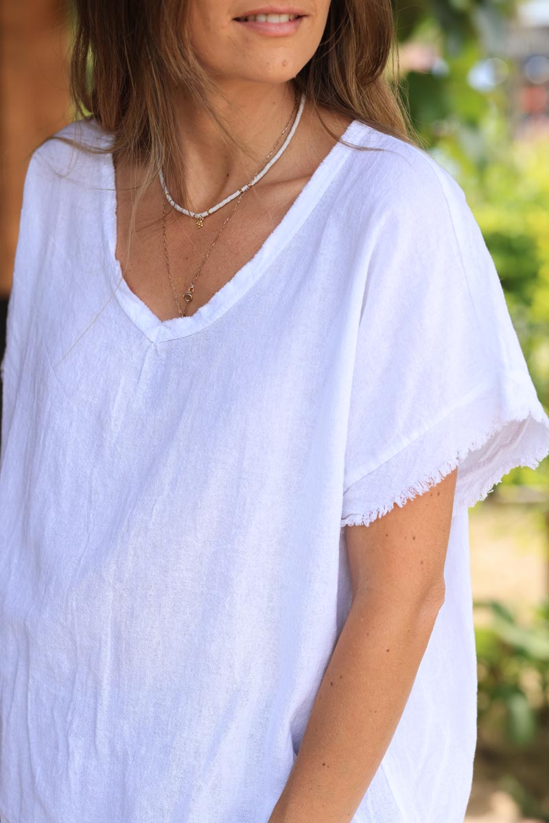 Top blanc en coton effet piqué détails et col v franges