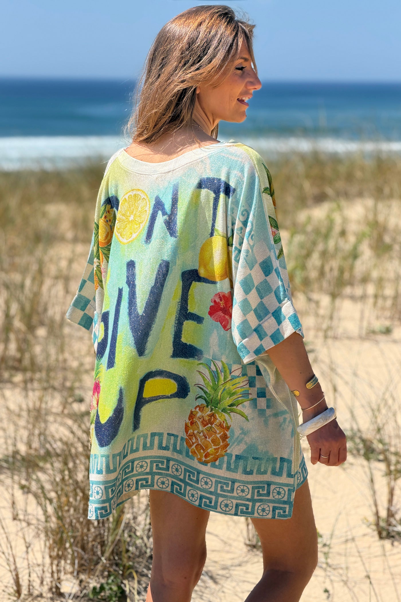 Cream “Don’t Give Up” Glitter Knit Tunic
