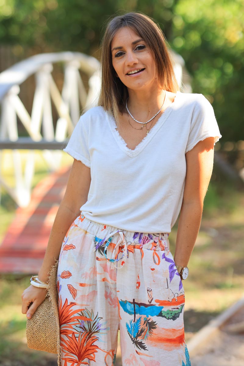 Camiseta de algodón elástico crudo con pequeños remates de flecos